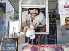  ?? Brian van der Brug Los Angeles Times ?? JOE NICCHI in his CVT Soft Serve ice cream truck, which he opened in Sherman Oaks in 2014. Instagram “inf luencers” keep asking him for free product.