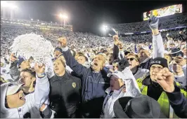  ?? ABBY DREY / CENTRE DAILY TIMES ?? Penn State coach James Franklin (center, celebratin­g with fans after the victory over Ohio State) says, “Our whole focus will be on Wisconsin.”