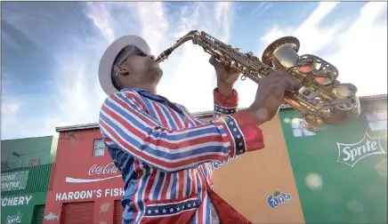  ?? PICTURE: IAN LANDSBERG/AFRICAN NEWS AGENCY/ANA ?? Marshelle Moolman, saxophonis­t for the Bonteheuwe­l Superstars minstrel troupe, prepares for the annual Cape Town Street Parade on January 2.