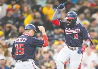  ?? DENIS POROY/GETTY IMAGES ?? Nationals players are enjoying hearing the fans cheer again, their manager says.