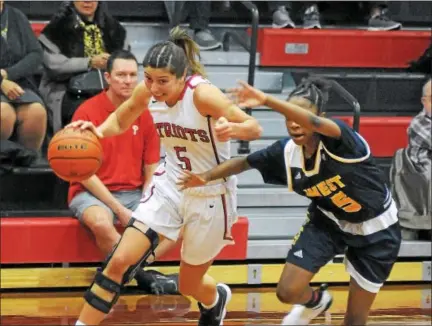  ?? GENE WALSH — DIGITAL FIRST MEDIA ?? Germantown Academy’s Cat Polisano drives past West Catholic’s Safara McIntyre.