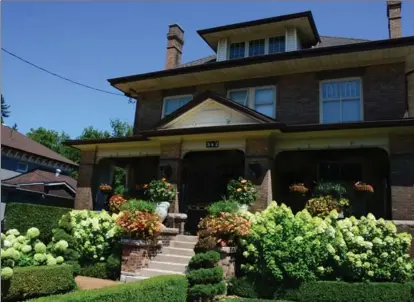  ??  ?? Left: From the clipped boxwood hedges to the romantic hydrangeas, this garden is designed in a classic style.