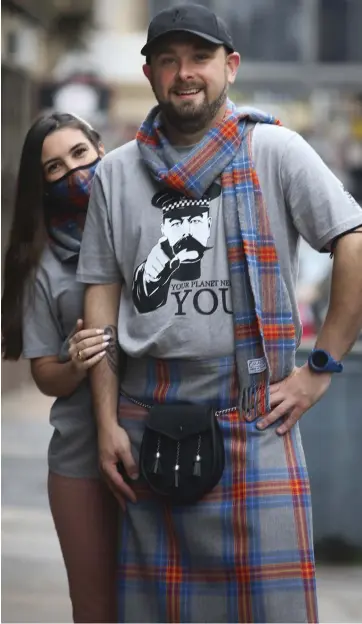  ?? Picture: Gordon Terris ?? Alan Arnott and Despoina Choutzoumi of Slanj Kilts wearing the Climate Emergency tartan