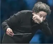  ??  ?? GUSTAVO DUDAMEL conducts a program of classical ballet music as the Los Angeles Philharmon­ic shifts to its summer home at the Hollywood Bowl.