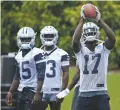  ?? AP FILE PHOTO ?? Cowboys wide receiver Allen Hurns, right, catches a pass as wide receivers Deonte Thompson, left, and Michael Gallup watch during practice at the Cowboys’ football training facility in Frisco, Texas.