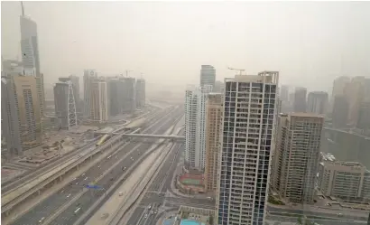  ?? Photo by Dhes Handumon ?? Hazy weather on Sheikh Zayed Road. Residents have been told to stay indoors and avoid spending time outside. —