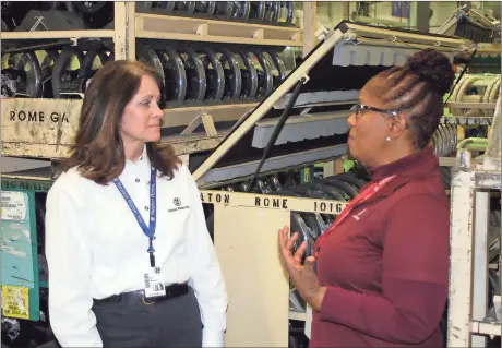  ?? Doug Walker / Rome News-Tribune ?? Rome News-Tribune SUNDAY,
Neaton Rome Inc. Human Resources Manager Teri Warner talks with Human Resources Supervisor Cordelia Aaron in front of brake assemblies at the plant, which is looking to fill numerous positions at a manufactur­ing job fair in...