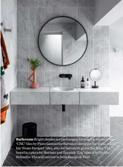  ??  ?? Bathroom Bright shades are exchanged for graphic monochrome. ‘CNC’ tiles by Piero Lissoni for Salvatori decorate the walls, while his ‘Stone Parquet’ tiles, also for Salvatori, grace the floor. The towel is a piece by Hermès and the pink ‘Zag’ vase is by Atelier Polyedre. The wall mirror is from Design & That