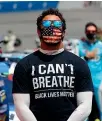  ??  ?? Bubba Wallace lobbied for Nascar to ban the Confederat­e flag from its event.