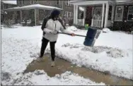  ?? PETE BANNAN – DIGITAL FIRST MEDIA ?? Rick Slater clears snow in front of his Coatesvill­e home during Wednesday’s snowstorm.