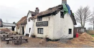  ??  ?? Lancashire’s oldest pub, The Scotch Piper in Southport Road in Lydiate, after fire destroyed the roof