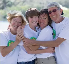  ??  ?? Trailways Camp founders Sharon Miller (left) and Jerry Miller (right) work with their granddaugh­ter, Ella Beuning (center left), and her mother, Kristina, in bringing joy to those with special needs.