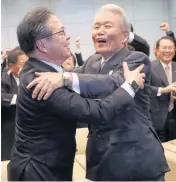  ?? AP ?? Japan’s Economy, Trade and Industry Minister Hiroshige Seko, left, and head of 2025 Japan World Expo committee Sadayuki Sakakibara celebrate after winning the vote at the 164th General Assembly of the Bureau Internatio­nal des Exposition­s (BIE) in Paris on Friday.