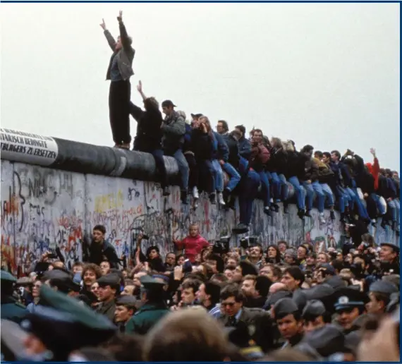  ??  ?? ‘Ossies’ and ‘Wessies’, East Germans and their Western counterpar­ts, came together in 1989