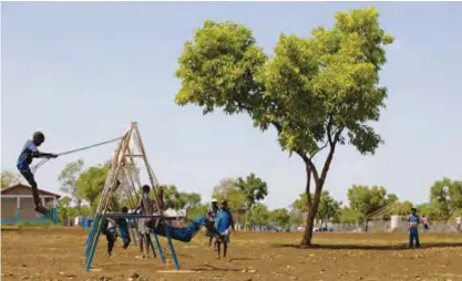  ??  ?? GAMBELA, Ethiopia: Unaccompan­ied children who travelled alone from South Sudan to the Ethiopian border, play on swings at the children friendly space of Plan Internatio­nal Nguenyyiel refuge camp in Gambela, Ethiopia. —AFP