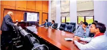  ??  ?? NSSF president Shirantha Peries making the developmen­t plan presentati­on to the Minister of Sports and other officials