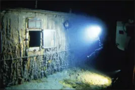  ?? WOODS HOLE OCEANOGRAP­HIC INSTITUTIO­N VIA AP ?? The deck of Titanic 12,500feet below the surface of the ocean, 400miles off the coast of Newfoundla­nd, Canada, in 1986. Rare and in some cases never-before-publicly-seen video of the dive is being released by the Woods Hole Oceanograp­hic Institutio­n.