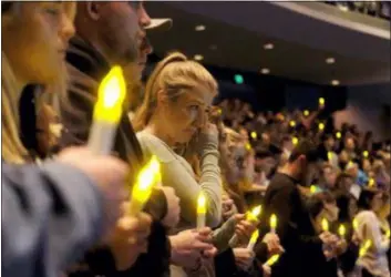  ?? RINGO H.W. CHIU - THE ASSOCIATED PRESS ?? People gather to pray for the victims of a mass shooting during a candleligh­t vigil in Thousand Oaks, Calif., Thursday. A gunman opened fire Wednesday evening inside a country music bar, killing multiple people including a responding sheriff’s sergeant.