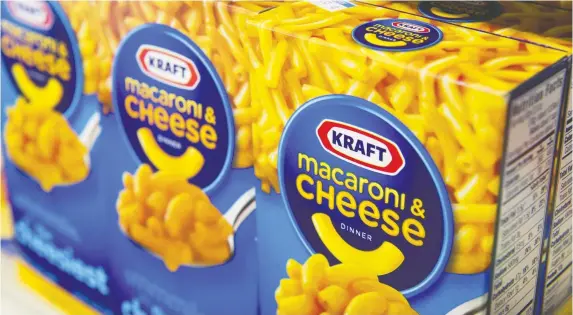  ?? DAVID PAUL MORRIS/BLOOMBERG FILES ?? Kraft Heinz has felt the domino effect of the COVID-19 crisis spurring panic buying. Even with the surge in orders, it is confident it can keep pace. Its Montreal plant can produce 600,000 boxes of Kraft Dinner per day.