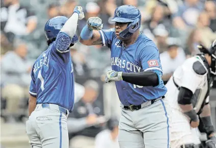 ?? MELISSA TAMEZ USA TODAY Sports ?? Kansas City Royals catcher Salvador Perez, right, celebrates with teammate MJ Melendez after hitting a two-run home run in the eight inning Wednesday during game one of a doublehead­er against the Chicago White Sox at Guaranteed Rate Field in Chicago.