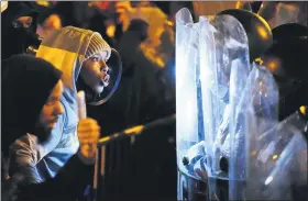  ?? MATT SLOCUM — THE ASSOCIATED PRESS ?? Protesters confront police during a march Tuesday in Philadelph­ia. Hundreds of demonstrat­ors marched over the death of Walter Wallace, a Black man who was killed by police in Philadelph­ia on Monday.