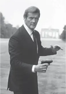  ?? FOTO: DPA ?? Roger Moore im Dienst Ihrer Majestät als James Bond ...