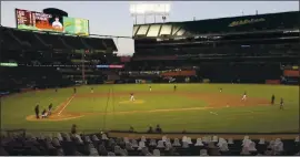  ?? JANE TYSKA — BAY AREA NEWS GROUP ?? Fan cutouts are seen as the Oakland Athletics play the San Francisco Giants in the sixth inning of their MLB exhibition game at the Coliseum in Oakland on July 20.