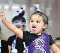  ??  ?? Togetherne­ss . . . Te Kohanga Reo Whakaari child Taupuhiara­ngi Hapuku Te Nahu ManuRatima (3) is happy to take part in the performanc­e.