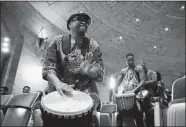  ?? JOE LAMBERTI/AP PHOTO ?? Karen Smith plays drums with her group Feb. 3 as a public commemorat­ion service for 19 unidentifi­ed Black Philadelph­ians, whose remains were part of a display at the University of Pennsylvan­ia’s Penn Museum.