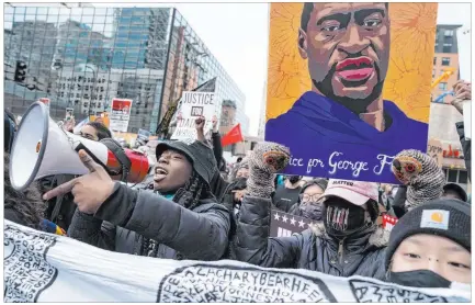  ?? John Minchillo The Associated Press ?? Demonstrat­ors rally Monday in Minneapoli­s, where closing arguments were held in the case against former Derek Chauvin.