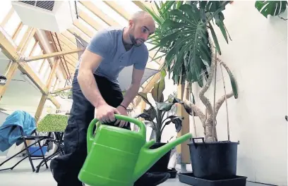  ??  ?? ●●Andrew hard at work at the garden centre