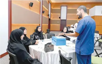  ?? ?? The event at the National Autism Center in Seeb featured a lecture, recreation­al workshops, and competitio­ns for children.