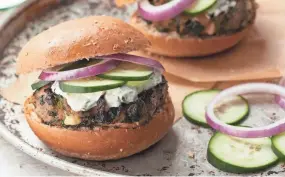  ?? JACOB FOX/EATINGWELL ?? This Greek-inspired burger features feta, tzatziki and sliced cucumber.