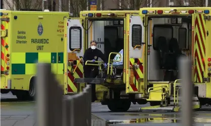  ?? Photograph: Brian Lawless/PA ?? Paramedics and ambulances at the Mater hospital in Dublin.