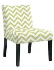  ?? ALLMODERN.COM/AP ?? Crisp, contempora­ry green and white chevrons make a bold statement on this Europa slipper chair from AllModern.