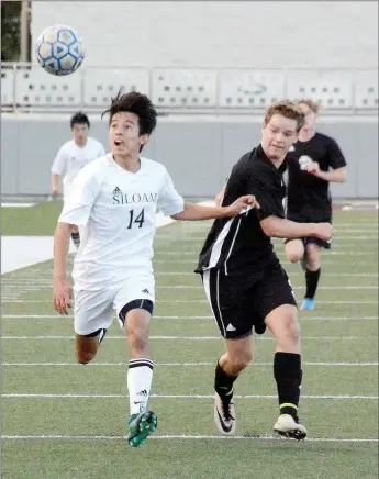  ?? Graham Thomas/Siloam Sunday ?? Siloam Springs senior Francisco Sifuentes, left, goes after a ball with Benton’s Kolton Ritter in pursuit Thursday during the 6A-West Conference Tournament semifinals at Panther Stadium. Sifuentes scored the go-ahead goal in the 72nd minute as Siloam...