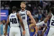  ?? GODOFREDO A. VÁSQUEZ — THE ASSOCIATED PRESS ?? Sacramento Kings forward Domantas Sabonis (10) celebrates with Harrison Barnes (40) during the second half of the team’s NBA basketball play-in tournament game against the Golden State Warriors, Tuesday, April 16, 2024, in Sacramento, Calif.