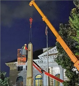  ?? AMANDA COYNE / AJC ?? A Confederat­e obelisk erected by the Daughters of the Confederac­y in 1908 is removed from Decatur Square the night of June 18. Superior Court Judge Clarence Seeliger ordered the monument removed after declaring it a public nuisance due to the protests and vandalism it attracted.