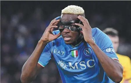  ?? AFP ?? Napoli forward Victor Osimhen celebrates after netting his team’s equalizer in Wednesday’s Champions League last-16, first-leg match against Barcelona at Stadio Diego Armando Maradona. The game ended 1-1, with the return leg in Spain on March 12.
