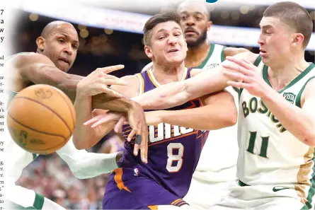  ?? PHOTO BY MADDIE MEYER/AFP ?? HACKED
Grayson Allen (8) of the Phoenix Suns, Payton Pritchard (11) of the Boston Celtics and Al Horford battle for a loose ball during the second quarter at TD Garden on Thursday, March 14, 2024, in Boston, Massachuse­tts.