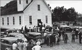  ?? AP 1946 ?? A crowd gathers at the Mt. Perry church near Monroe, for funeral services July 28, 1946, for two of the four Black victims of a mob, George Dorsey and Dorothy Malcolm. The church is about 16 miles from the lynching site.
