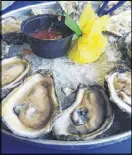  ?? FIGUERAS / LFIGUERAS@AJC.COM ?? Raw oysters at Flounder’s in Pensacola Beach, Fla., were one of the few things that Ligaya Figueras’ son, Alvaro, wouldn’t eat on vacation. LLIGAYA