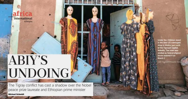  ?? Ethiopia Gallo Images/AFP/Eduardo Soteras ?? Under fire: Children stand in the door of a damaged shop in Wukro, just north of the Tigrayan capital, Mekelle. The town was shelled as federal-aligned forces entered it on March 1