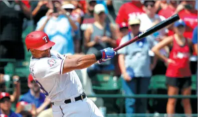  ?? TONY GUTIERREZ / AP ?? Texas Rangers’ Adrian Beltre follows through on a double for his 3,000th career hit which came off a pitch from Baltimore Orioles’ Wade Miley in the fourth inning of their MLB game on Sunday in Arlington, Texas. The Orioles won 10-6.