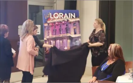  ?? KEITH REYNOLDS — THE MORNING JOURNAL ?? The Visit Lorain County 2019 Visitors Guide is unveiled at a meeting March 19 at the Norton Culinary Arts Center at Lorain County Community College, 1005 N. Abbe Road in Elyria.