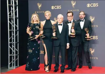  ?? RALSTON/AFP MARK ?? Lorne Michaels and the cast of pose with the Emmy Award for Outstandin­g Variety Sketch Series during the Emmy Awards at the Microsoft Theatre on September 17 in Los Angeles.