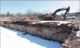  ?? Christian Abraham / Hearst Connecticu­t Media ?? Crews work on the former Star Pin factory site along Canal Street in Shelton last week. Shelton Mayor Mark Lauretti discussed plans to clean up and eventually develop the factory which was destroyed in a fire last summer.