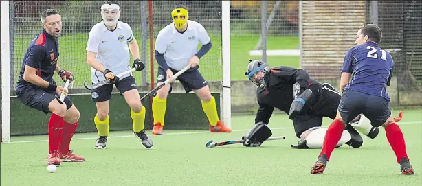  ?? Picture: Paul Amos. FM22362687 ?? Ashford force a good save from the Maidstone keeper during Saturday’s match at Ball Lane