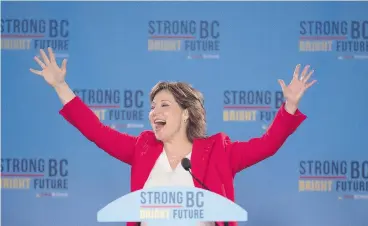  ?? JONATHAN HAYWARD / THE CANADIAN PRESS ?? B.C. Liberal Leader Christy Clark waves to the crowd following her minority election win Wednesday. A Liberal victory was key to the survival of Trudeau’s grand design on the economy and environmen­t, writes John Ivison.