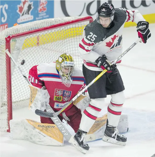  ?? — THE CANADIAN PRESS ?? Team Canada forward Nicholas Roy tries to deflect the puck past Czech Republic goalie Daniel Vladar during the third period of their world junior hockey championsh­ip pre-tournament game Wednesday at Canadian Tire Centre in Ottawa.